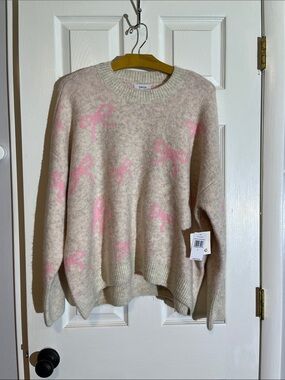 CeCe Malted Prism Pink Crewneck Sweater with Pink Bow Pattern